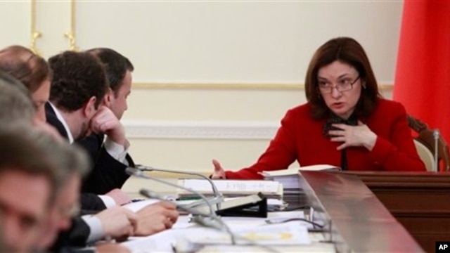 Russian presidential aide Elvira Nabiullina, right, at a meeting on fuel and energy, Novo-Ogaryovo residence, near Moscow, Feb. 13, 2013.