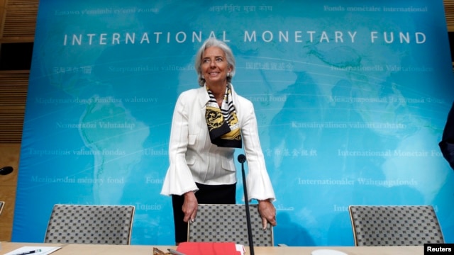 Tổng giám đốc IMF Christine Lagarde đến dự họp báo tại trự sở IMF ở thủ đô Washington, ngày 14 tháng 6, 2013. (REUTERS/Jose Luis Magana )