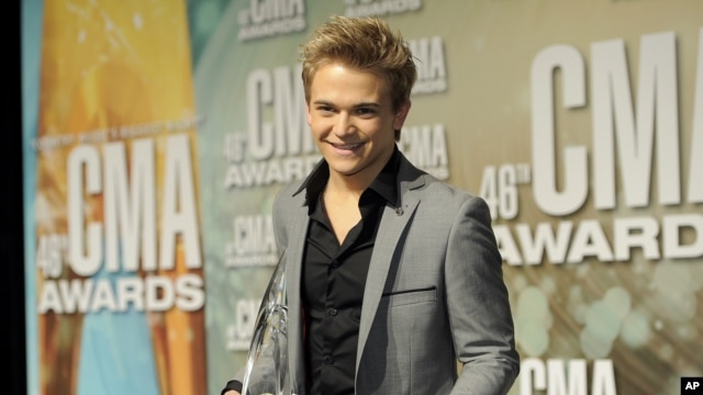 Hunter Hayes poses backstage with the new artist of the year award at the 46th Annual Country Music Awards at the Bridgestone Arena on Nov. 1, 2012, in Nashville, Tenn.