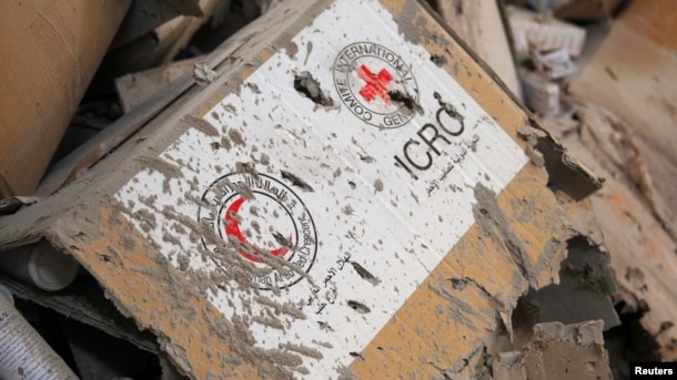 Damaged Red Cross and Red Crescent medical supplies lie inside a warehouse after an airstrike on the rebel held Urm al-Kubra town, western Aleppo, Syria Sept. 20, 2016.