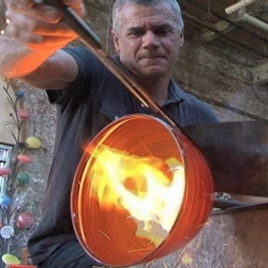 Baltimore glass blower Anthony Corradetti shapes a decorative bowl he will later sell in his studio gift shop.