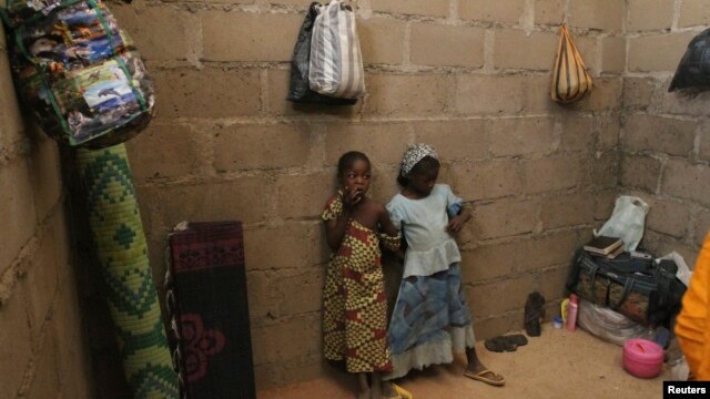 FILE - Children who escaped Boko Haram attacks in both Nigeria and Cameroon are seen inside an uncompleted house as they seek shelter in Adamawa, Nigeria, Jan. 31, 2015. 