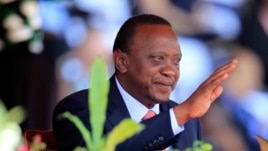 Kenya's President Uhuru Kenyatta reacts as he attends Mashujaa (Heroes) Day at the Nyayo National Stadium in capital Nairobi, Oct. 20, 2013.