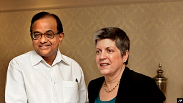 Indian Home Minister P Chidambaram, left, shakes hands with US Secretary of Homeland Security Janet Napolitano, prior to a delegation level meeting in New Delhi, India, May 27, 2011.
