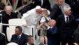 Pope Francis kisses a child at the end of a mass in Saint Peter's Square at the Vatican, May 19, 2013.  