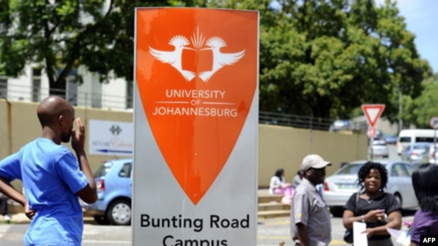 Experts say in addition to a high dropout rate, South Africa does not produce enough students with the skills for higher education in math and science. Students are shown outside the University of Johannesburg in January.