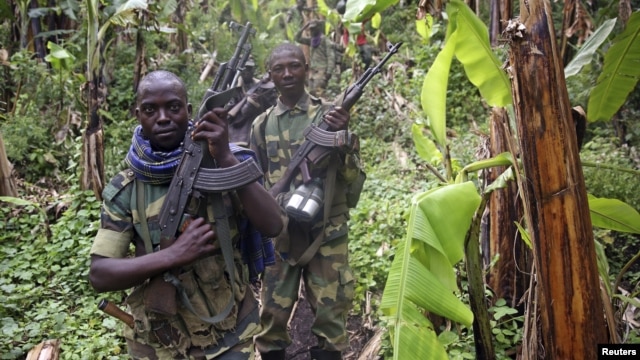 M23 rebel fighters are pictured as they withdraw near the town of Sake, some 42 km west of Goma on Nov. 30, 2012.