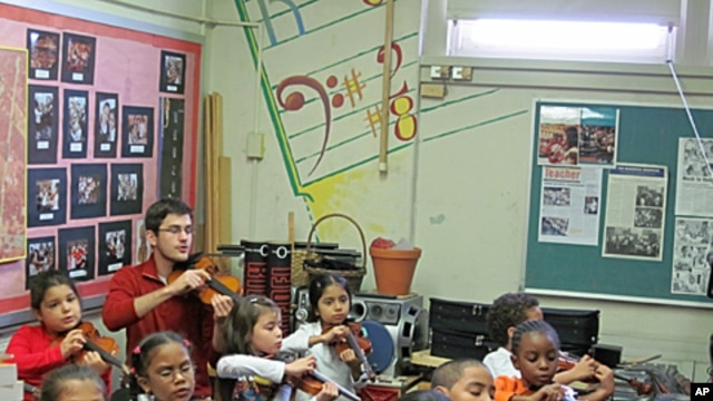 Academy fellow Nathan Schram works with students in New York.