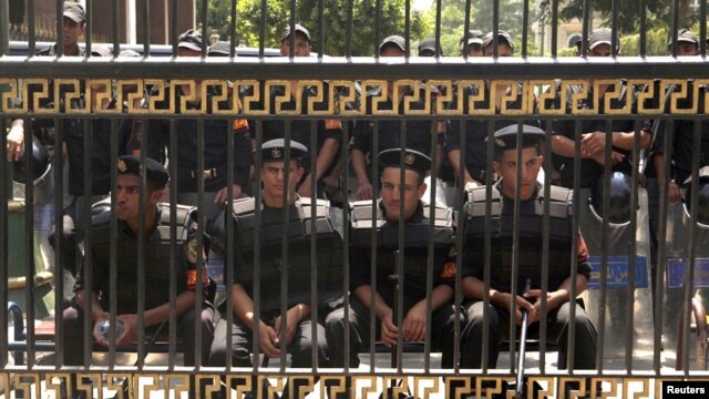 Members of the riot police in front of the parliament building in Cairo, July 10, 2012. 