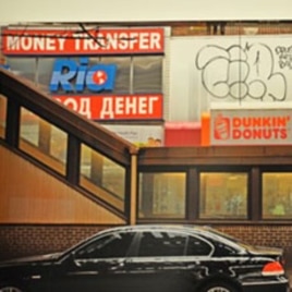 An exhibit photo of a doughnut shop in Brighton Beach, a Russian-speaking neighborhood in New York