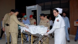 In this photo released by Inter Services Public Relations Department, Pakistani army doctors and medical staff transport 14-year-old schoolgirl Malala Yousufzai, who was shot last Tuesday by the Taliban, to transfer her from a military hospital to the air