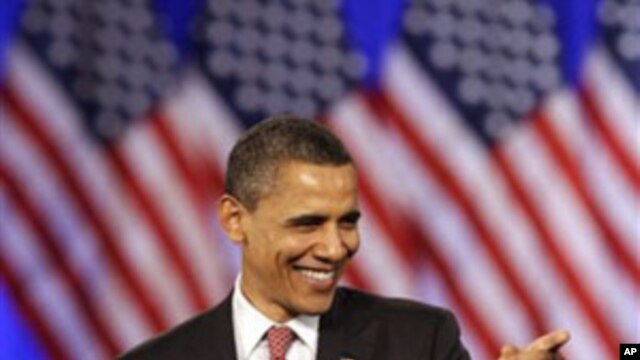 President Barack Obama smiles as he points to his supporters at a DNC fundraising event at Navy Pier in Chicago, Thursday, April 14, 2011