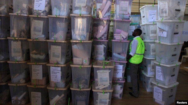 An IEBC official inspects ballot boxes at Kasarani gymnasium, Nairobi, March 5, 2013.