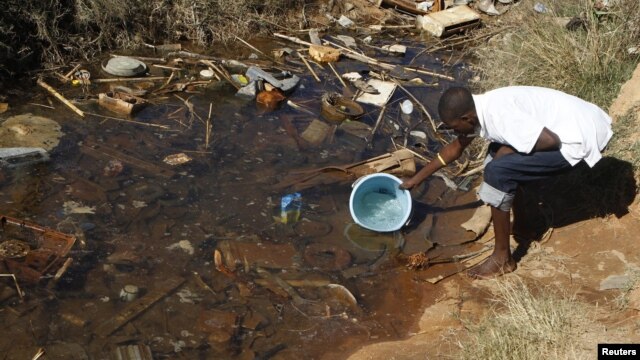 Residences of Mabvuku fetch water from unprotected sources in Harare, Zimbabwe, July 28, 2012.