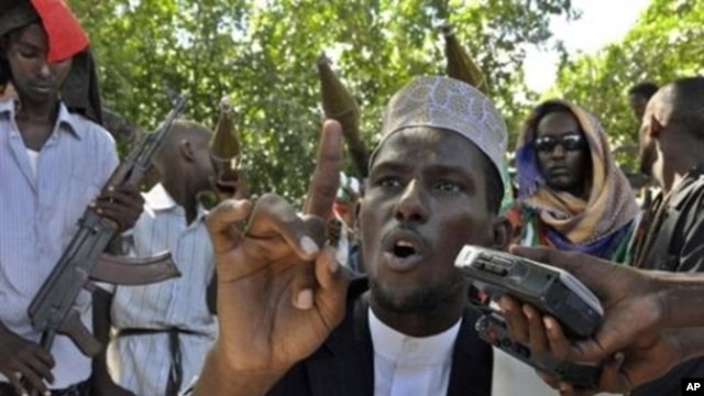 Sheik Abdulahi Sheik Abirahman Al-Qadi, the spokesman of the Pro-government Ahlu-Sunna group speaks during a press conference near a frontline in southern Mogadishu (File Photo)