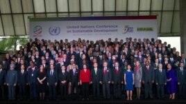 Presidents and other officials stand for a group picture at the United Nations Conference on Sustainable Development in Rio de Janeiro, Brazi. 