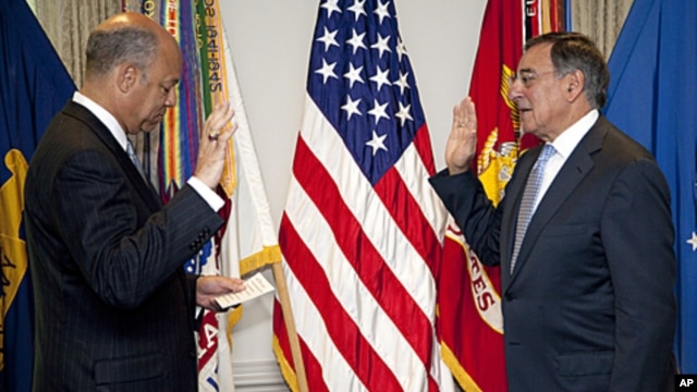 Leon Panetta is sworn is as Defense Secretary Pentagon General Counsel Jeh Johnson, at the Pentagon, July 1, 2011