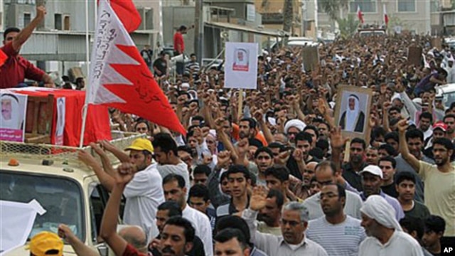 Thousands chant anti-government slogans as they march during a funeral procession for Sayed Hameed Mahfoodh, 61, whom relatives allege was killed by police, in the western Shiite Muslim village of Saar, Bahrain, April 6, 2011