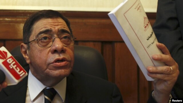Egypt's General Prosecutor Abdel Maguid Mahmoud speaks to reporters in his office in the High Court in Cairo, October 13, 2012.  