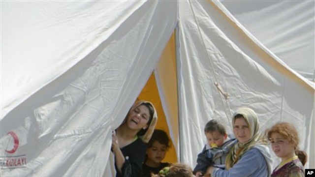 Syrian refugees are seen in a camp, in Boynuyogun, Turkey, Tuesday, June 14, 2011.