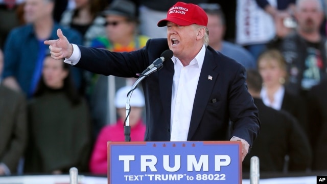 FILE - Republican presidential candidate Donald Trump points as he speaks during a rally Feb. 28, 2016.