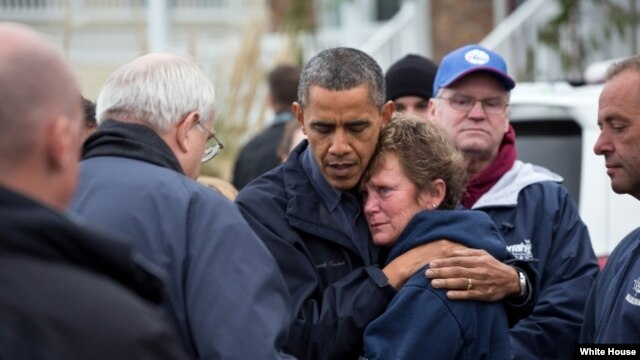 President Barack Obama hugs Donna Vanzant, the owner of North Point Marina, as he tours damage from Hurricane Sandy in Brigantine, N.J., Oct. 31, 2012. (White House/Pete Souza)
