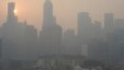 The sun rises over the Singapore Central Business District, or CBD skyline as the haze or smog envelopes the city, June 20, 2013.
