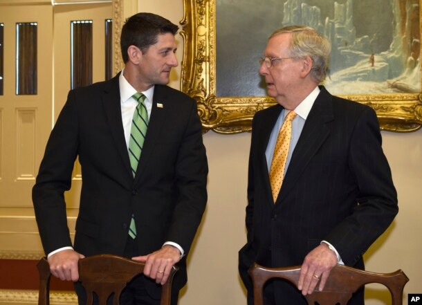 FILE - House Speaker Paul Ryan of Wis., left, talks with Senate Majority Leader Mitch McConnell of Ky., on Capitol Hill in Washington.