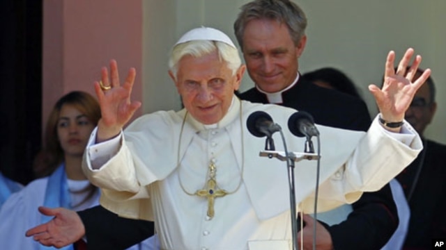 Pope Benedict XVI gestures to believers after visiting the sanctuary of the Virgin of Charity of El Cobre in El Cobre village, Cuba, March 27, 2012.