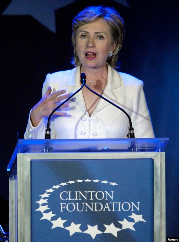 FILE - Then-Senator Hillary Clinton, wife of former U.S. President Bill Clinton, speaks at a fundraising gala for the Clinton Foundation in New York, Oct. 28, 2006.