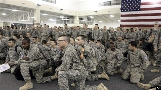 U.S. Army soldiers from 1st Brigade, 3rd Infantry Division, gather for a briefing after arriving at Hunter Army Airfield in Savannah, Ga. after an 18-hour journey home from a yearlong deployment in Iraq, (File Photo - 04 Dec 2010)