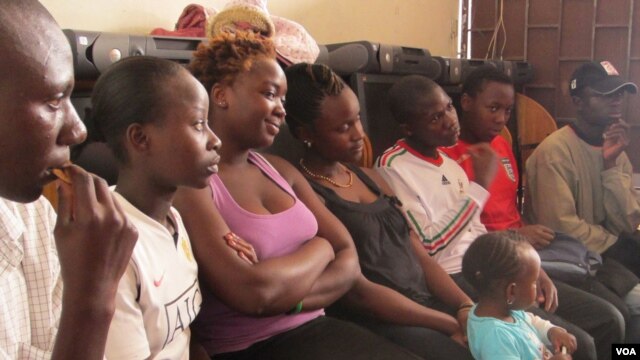 "Members of the Scars to Stars adult orphan support group discuss issues on July 1, 2012 in Nairobi. (VOA Photo/Jill Craig)
