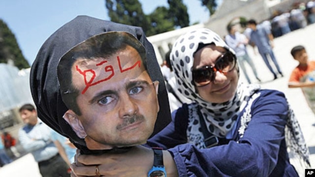 A demonstrator poses with an effigy of Syria's President Bashar al-Assad during a protest in Istanbul June 24, 2011. Due to restricted foreign media access, few images of anti-government protests within Syria have made it out of that country.
