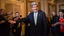 Senator John Kerry emerges after a unanimous vote by the Senate Foreign Relations Committee approving him to become America's next top diplomat, January 29, 2013. 