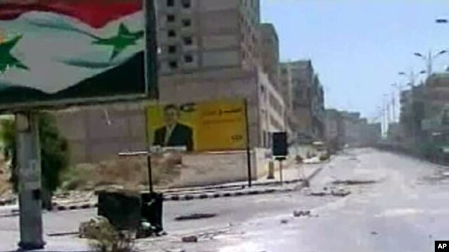 Image released by the Syrian official news agency SANA, empty streets with debris are shown of what SANA describes as the Syrian army restoring "security and stability" to the central city of Hama, August 4, 2011