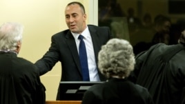 Kosovo's former Prime Minister and former commander of the Kosovo Liberation Army Ramush Haradinaj smiles during the verdict reading in his retrial at the International Criminal Tribunal for the former Yugoslavia in The Hague November 29, 2012.