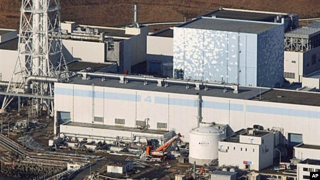 An aerial view shows the quake-damaged Fukushima nuclear power plant in the Japanese town of Futaba, Fukushima prefecture, Japan, run by Tokyo Electric Power, March 12, 2011