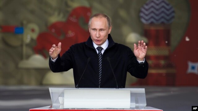 FILE - Russian President Vladimir Putin addresses Russian volunteers in Moscow, Russia, June 1, 2016.