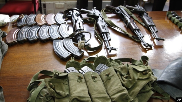  Some of the arms and  ammunition recovered by police  displayed in Nairobi, Kenya, September 14, 2012. 