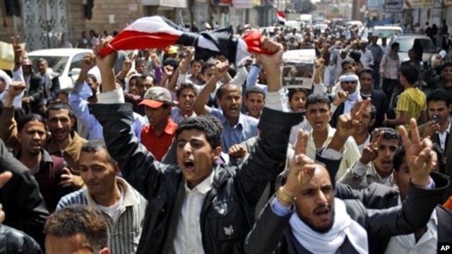Yemeni anti-government demonstrators chant slogans during a demonstration celebrating the resignation of Egyptian leader Hosni Mubarak and demanding the ouster of their own president, in Sanaa, Yemen, Feb 12, 2011