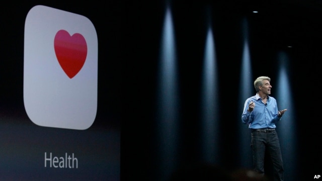 FILE - Apple senior vice president of Software Engineering Craig Federighi speaks about the Apple HealthKit app at the Apple Worldwide Developers Conference in San Francisco.