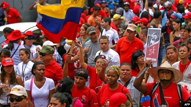 Supporters of Venezuelan President Hugo Chavez take part in a rally in Caracas to commemorate 24 years of the Patriotic Rebellion of 1989, Feb. 27, 2013,