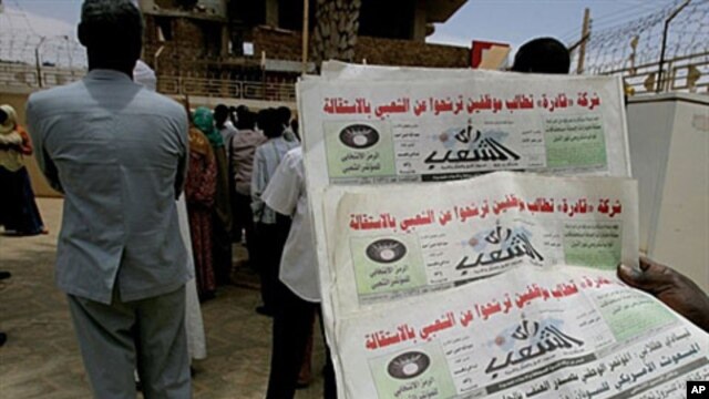 A Sudanese man holds three archive copies of 'Rai al-Shaab' newspaper which was confiscated, 16 May 2010.
