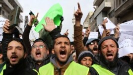 Jordanians chant slogans during a protest against cartoons depicting the Prophet Muhammad in the French magazine Charlie Hebdo, after Friday prayers in Amman, Jan. 16, 2015.