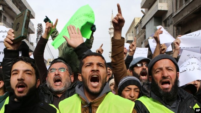 Jordanians chant slogans during a protest against cartoons depicting the Prophet Muhammad in the French magazine Charlie Hebdo, after Friday prayers in Amman, Jan. 16, 2015.