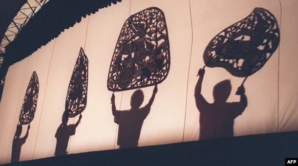 FILE - Members of the Cambodia National Theatre perform the ancient art of shadow puppetry in Phnom Penh on September 27.