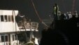 FILE - Workers salvage boat which sank after colliding with ferry near Lamma Island off the southwestern coast of Hong Kong, Oct. 2, 2012.