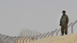 An Israeli soldier secures an area near the border between Israel and Egypt, June 18, 2012.