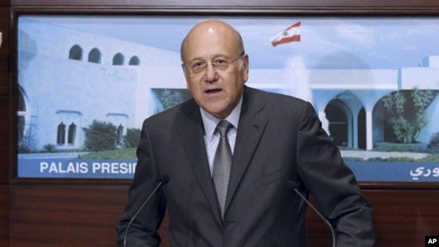 New Lebanese Prime Minister Najib Mikati, speaks after the announcing of the new cabinet, at the Presidential Palace in Baabda, east of Beirut, Lebanon, June 13, 2011