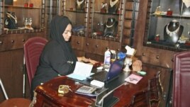 A Saudi saleswoman works at a jewelry shop in Jeddah, January 9, 2012. 